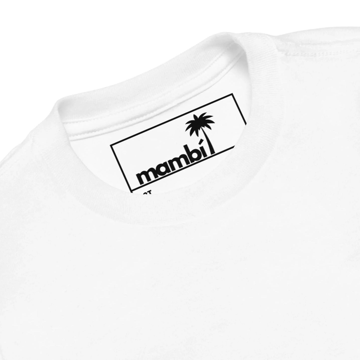 Close-up of a white t-shirt showing the inside label with a palm tree illustration and the brand name Mambí printed in black.