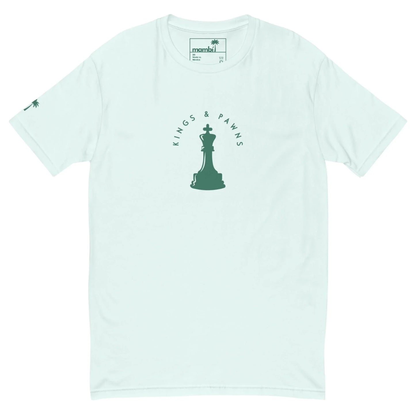 Light blue Mambí t-shirt featuring a green chess king piece graphic in the center, surrounded by the words “KINGS & PAWNS.” A small palm tree accents the left sleeve.