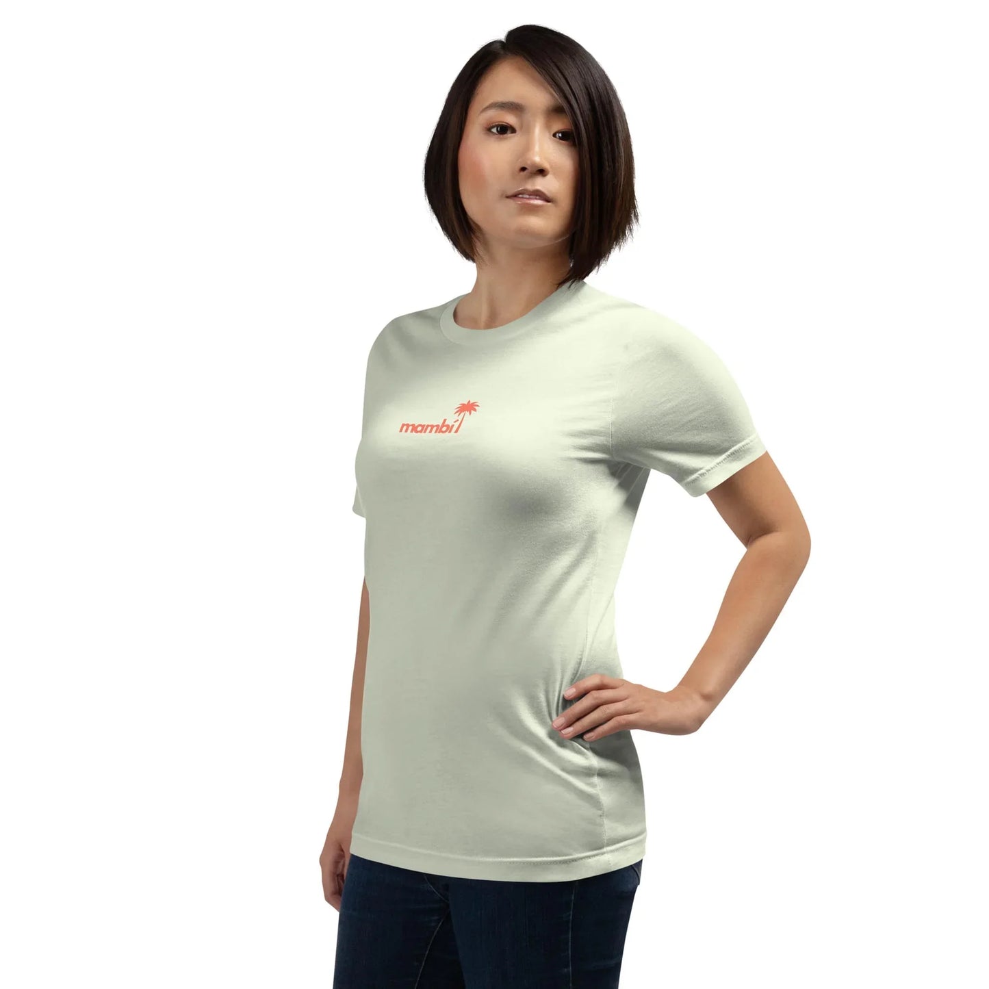 A woman with short, dark hair stands confidently in the Printful Knowledge Graphic Tee, a comfy unisex cotton shirt paired with dark jeans, on a plain white background.