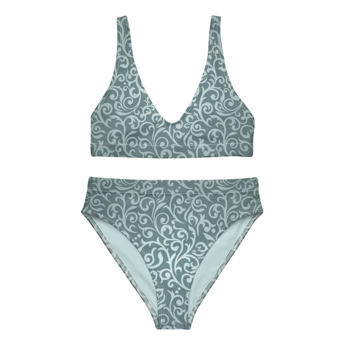 The Laurelia High-Waisted Bikini Swimsuit for women by Printful is a muted teal set with a deep V-neck top, removable pads, and matching bottoms, both featuring an elegant light swirl and floral pattern.
