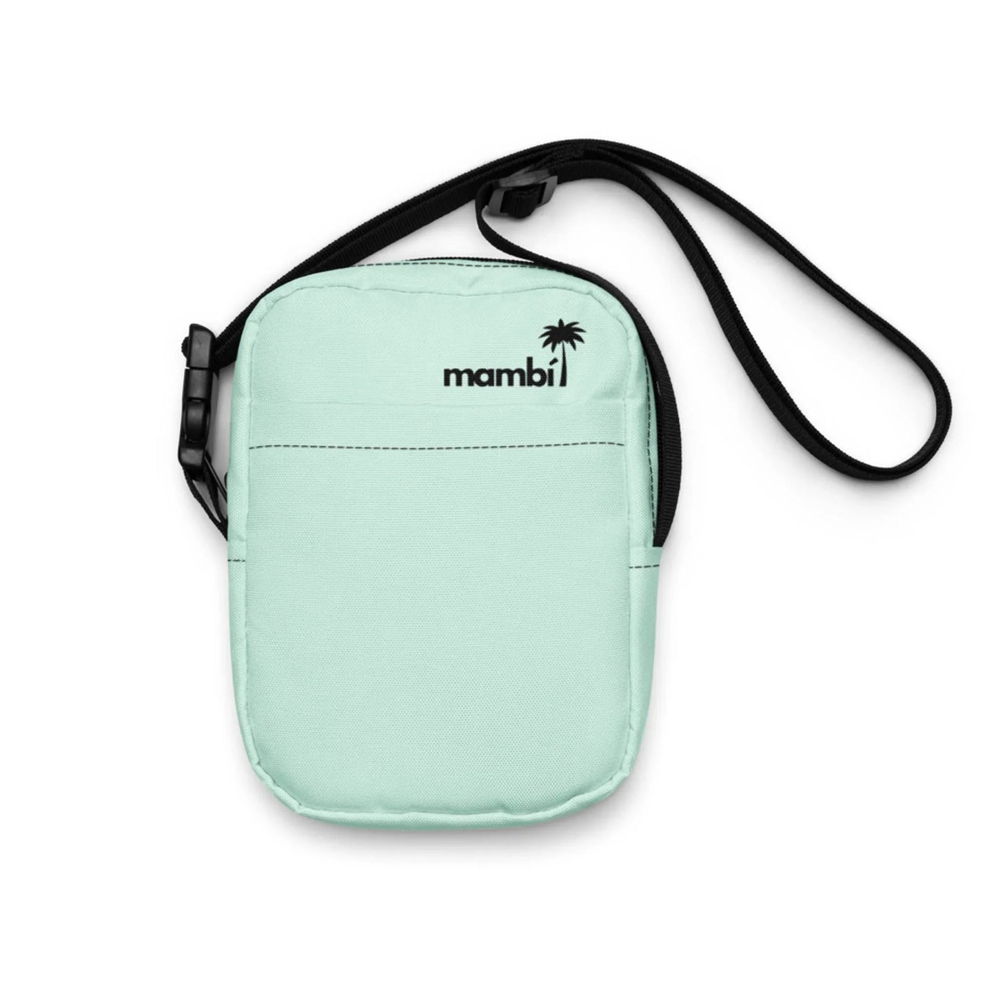 A small, mint green Mambí crossbody bag with a black adjustable strap and a black logo next to a palm tree icon on the front. Features a front pocket and zipper closure.