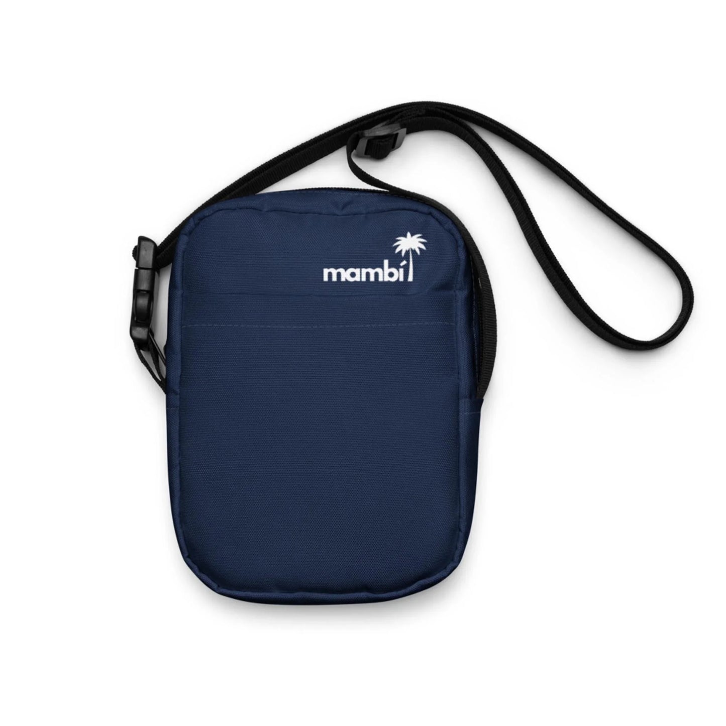 A small navy blue Mambí crossbody bag with a black adjustable strap and a white logo featuring a palm tree graphic on the front.