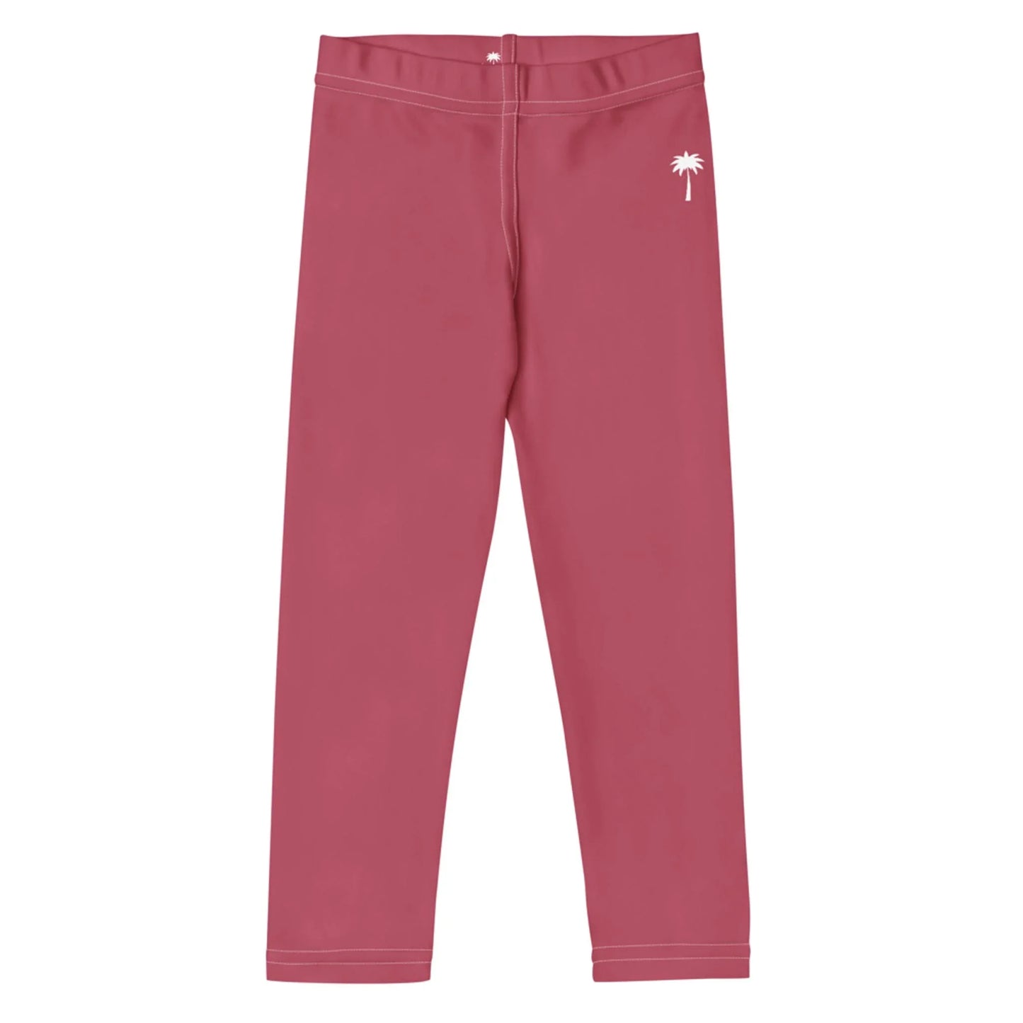 Pink Mambí leggings featuring a white palm tree graphic near the left hip, shown laid flat on a white background.