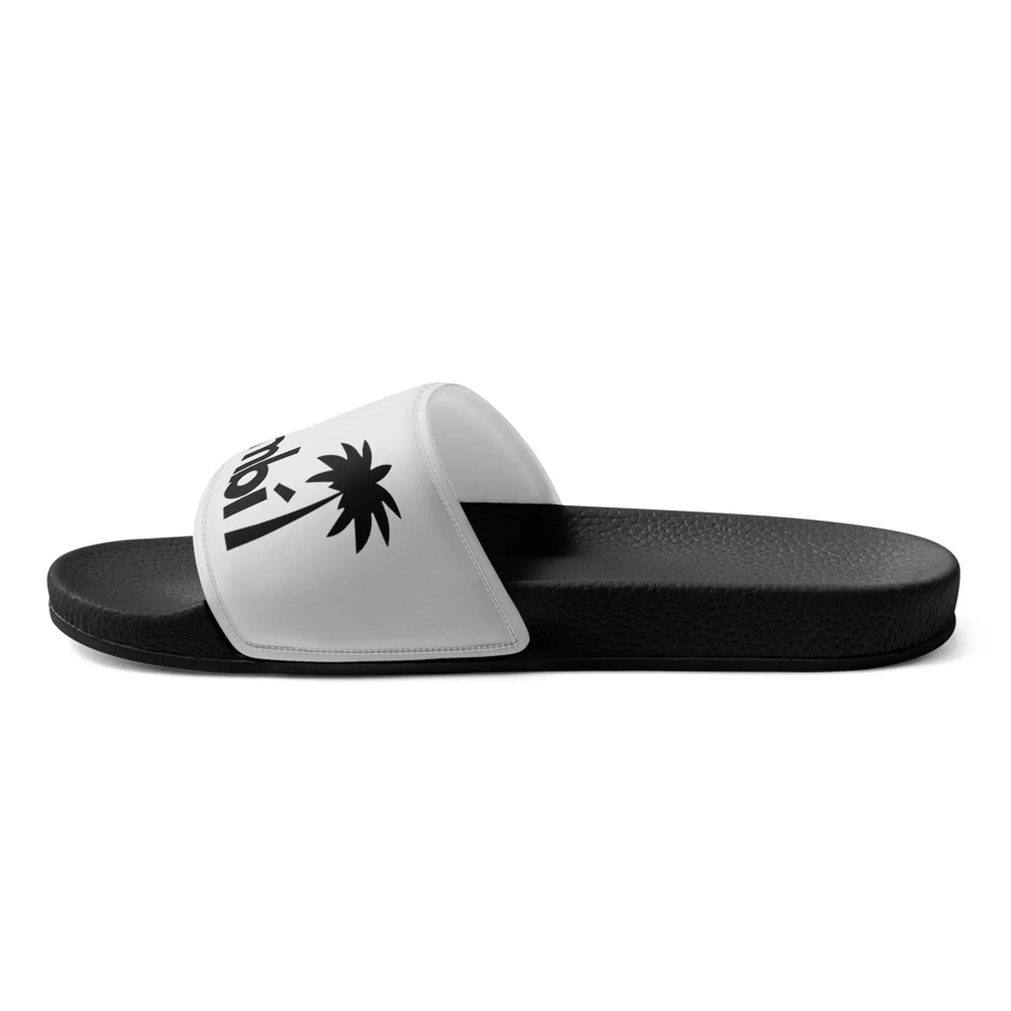 The Printful Malibu Chancleta Slides for men feature a cushioned upper and a white strap with a black palm tree graphic and partial text, shown in side profile on a white background. Color: Black/Whisper.