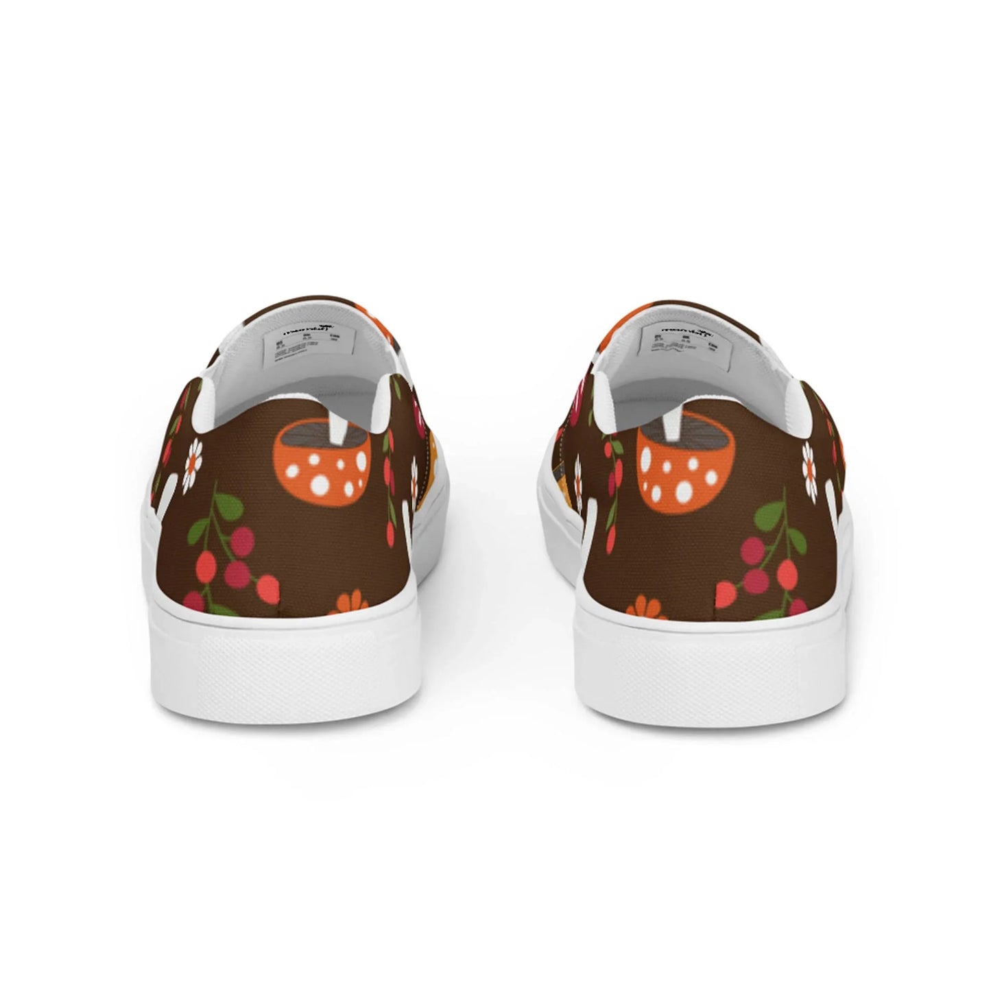 The Mario Handmade Slip-On Canvas Shoes for men by Printful feature a brown background with vibrant orange mushrooms, red berries, and floral patterns. Viewed from the back, they have white soles and lining—stylish and eye-catching.