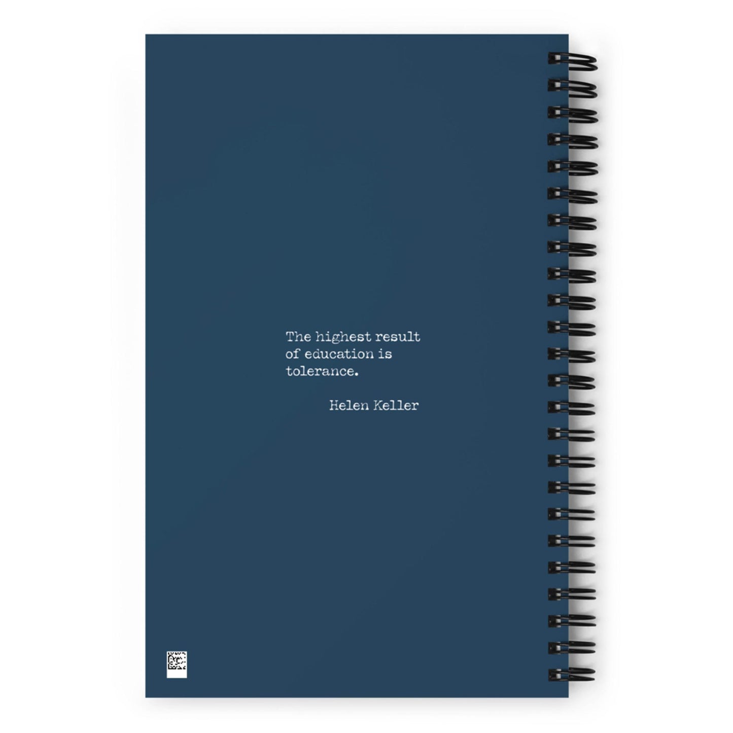 A dark blue spiral notebook with the quote The highest result of education is tolerance. — Helen Keller printed in white text on the cover.