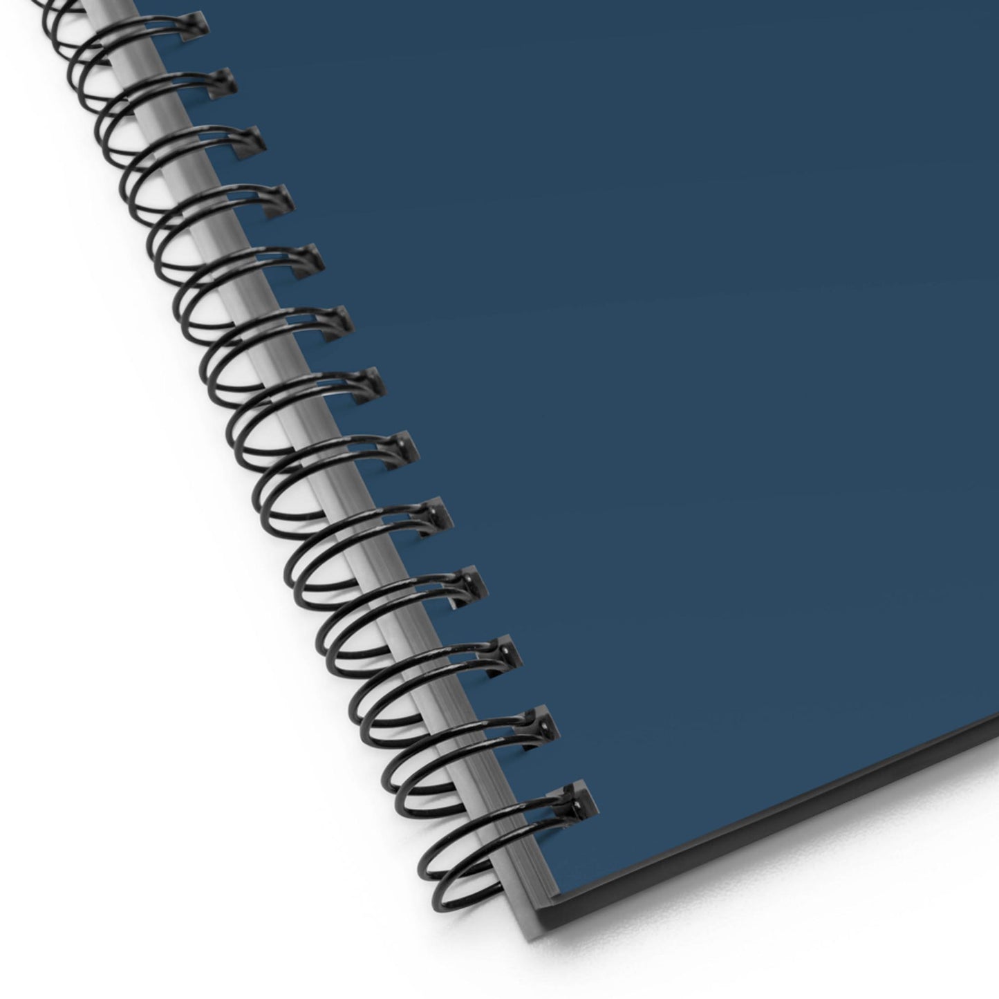 Close-up of a custom wire-bound notebook with a dark blue cover, showing the black spiral binding on the left side against a white background.