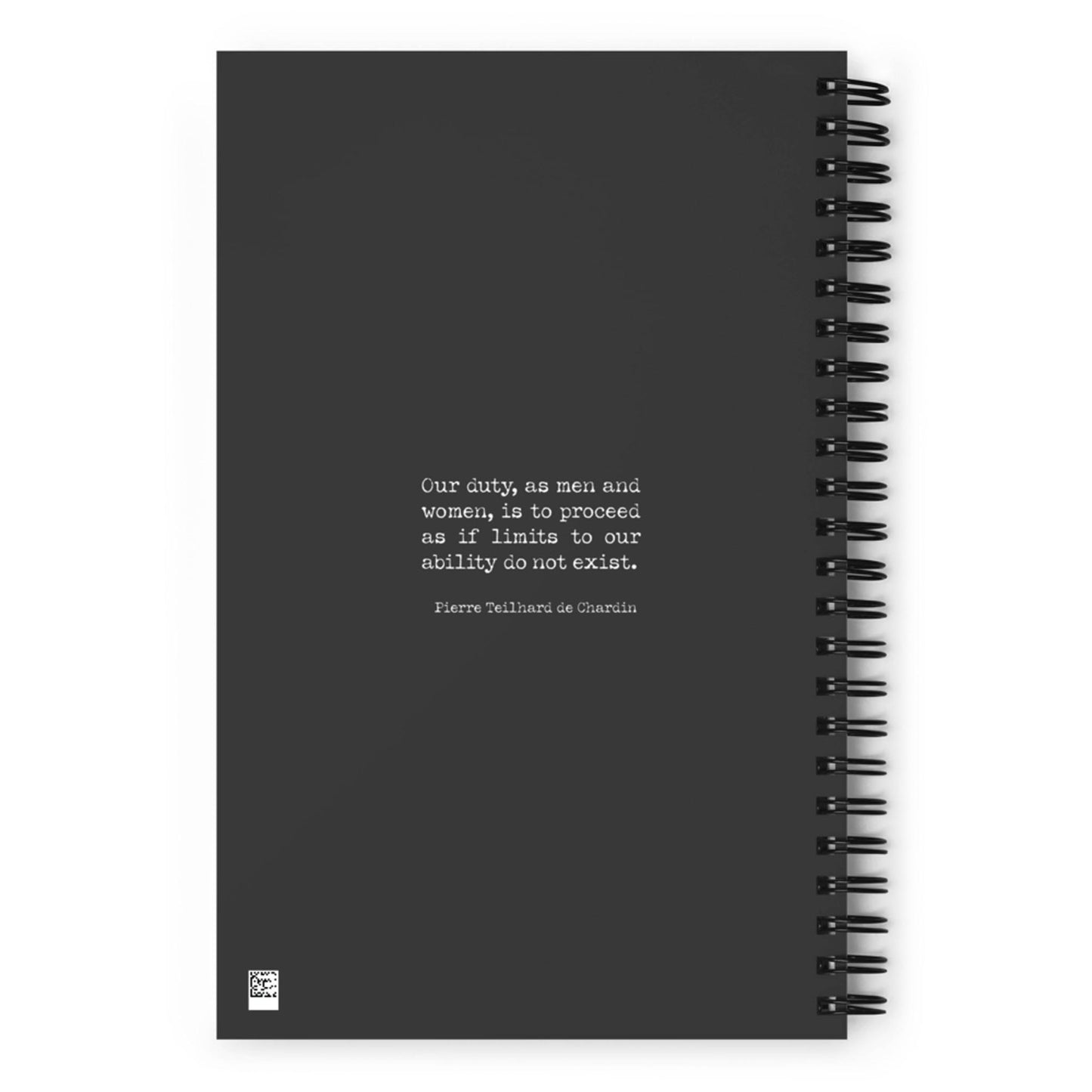 A custom wire-bound notebook featuring a motivational quote by Pierre Teilhard de Chardin on the cover: Our duty, as men and women, is to proceed as if limits to our ability do not exist.