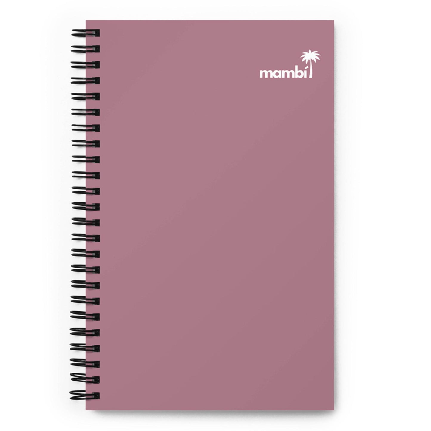 A mauve spiral-bound notebook with a plain cover, featuring dotted pages. The top right corner displays a small white palm tree icon and the brand name mambi in white text—a perfect daily companion notebook.
