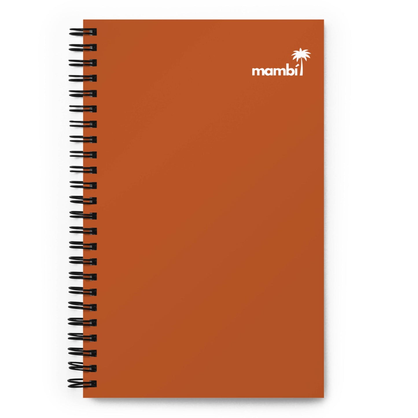 A wire-bound notebook with a plain reddish-brown cover. In the upper right corner, there is a white palm tree graphic next to the word mambi in lowercase white letters.