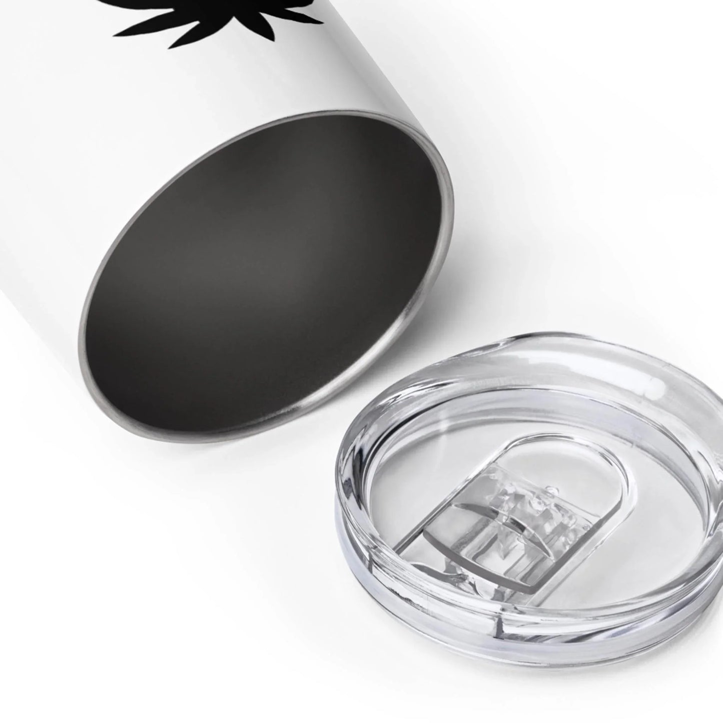 A close-up of a Mambí stainless steel tumbler with a white exterior and a transparent plastic lid placed next to it on a white background.