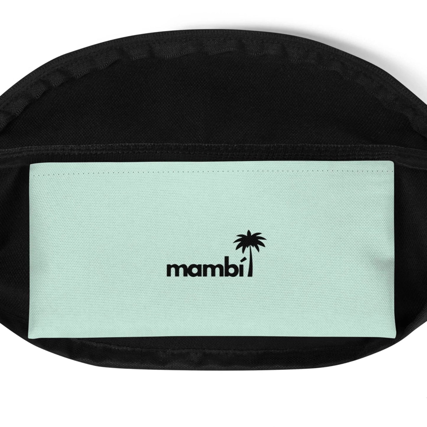 A close-up of an open black bag reveals a light green inner pocket with the word Mambí and a small black palm tree graphic printed above it.