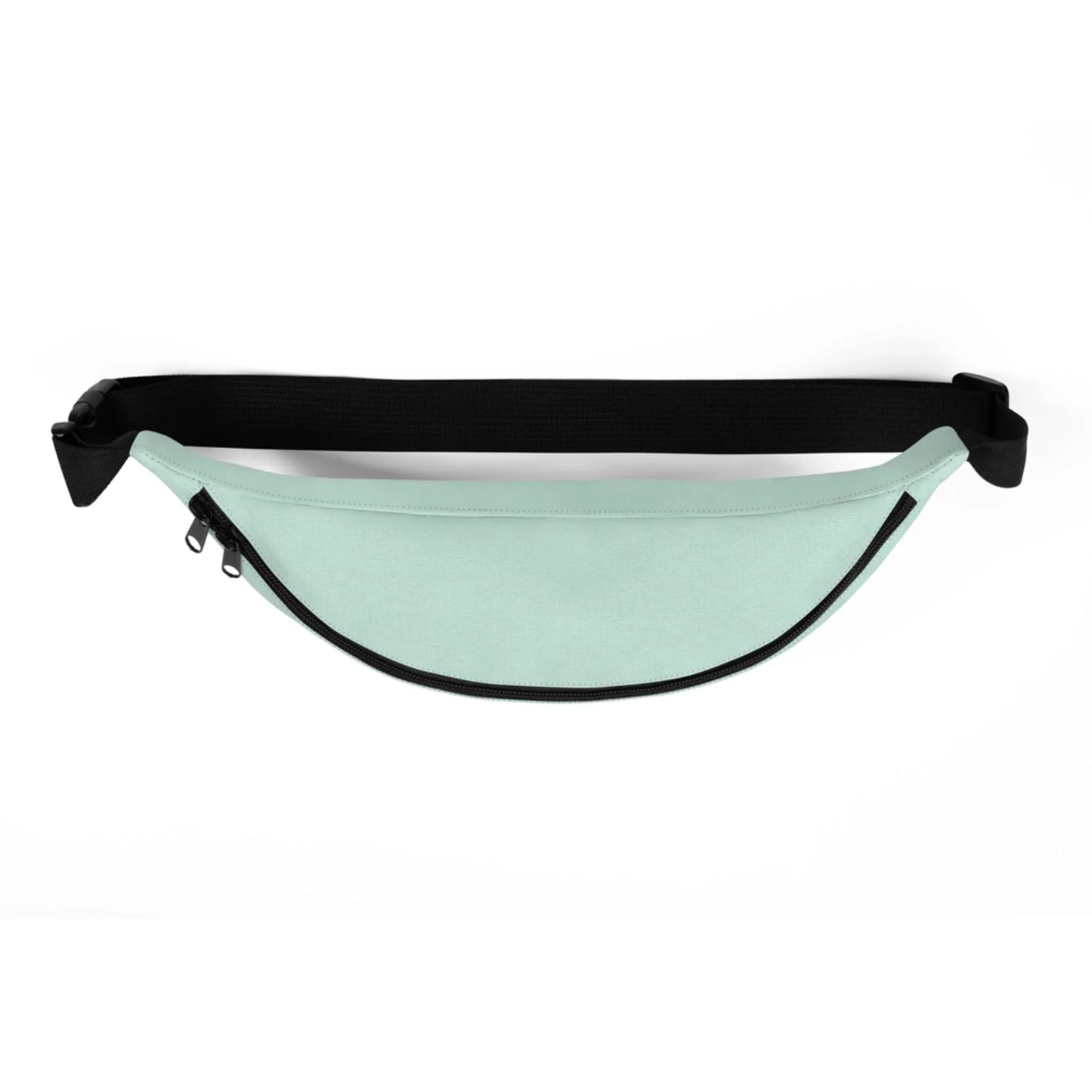 A mint green Mambí fanny pack with a black zipper and adjustable strap, displayed on a white background.