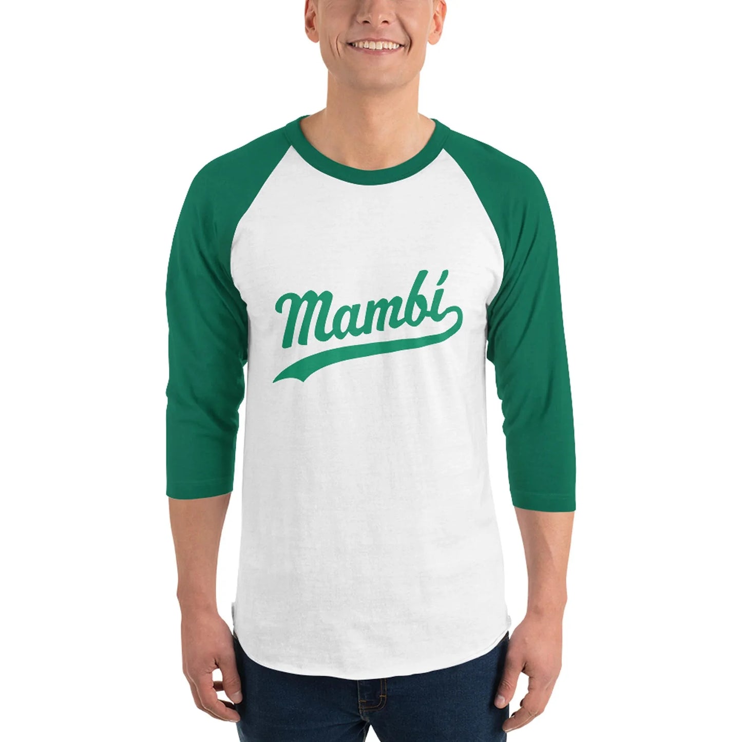 A person wearing a white and green baseball-style shirt with Mambí written in green script on the front smiles while standing against a plain background.