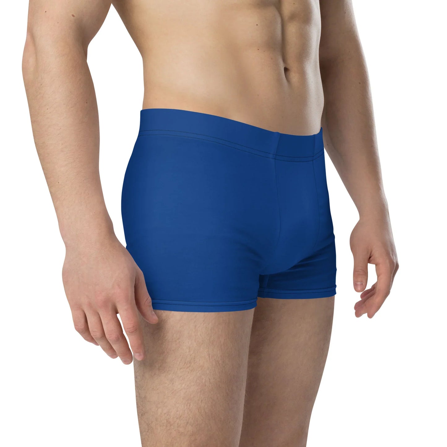 A person wearing fitted blue boxer briefs with a lined front pouch, shown from the mid-torso to mid-thigh, standing against a plain white background.