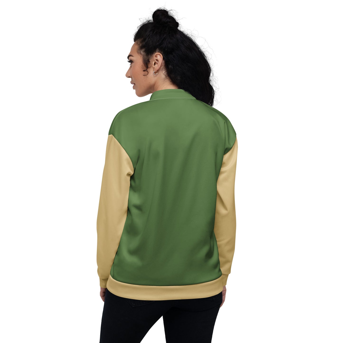 Woman with curly dark hair wearing a green and beige varsity bomber jacket with premium stitching, standing with her back to the camera against a plain white background.