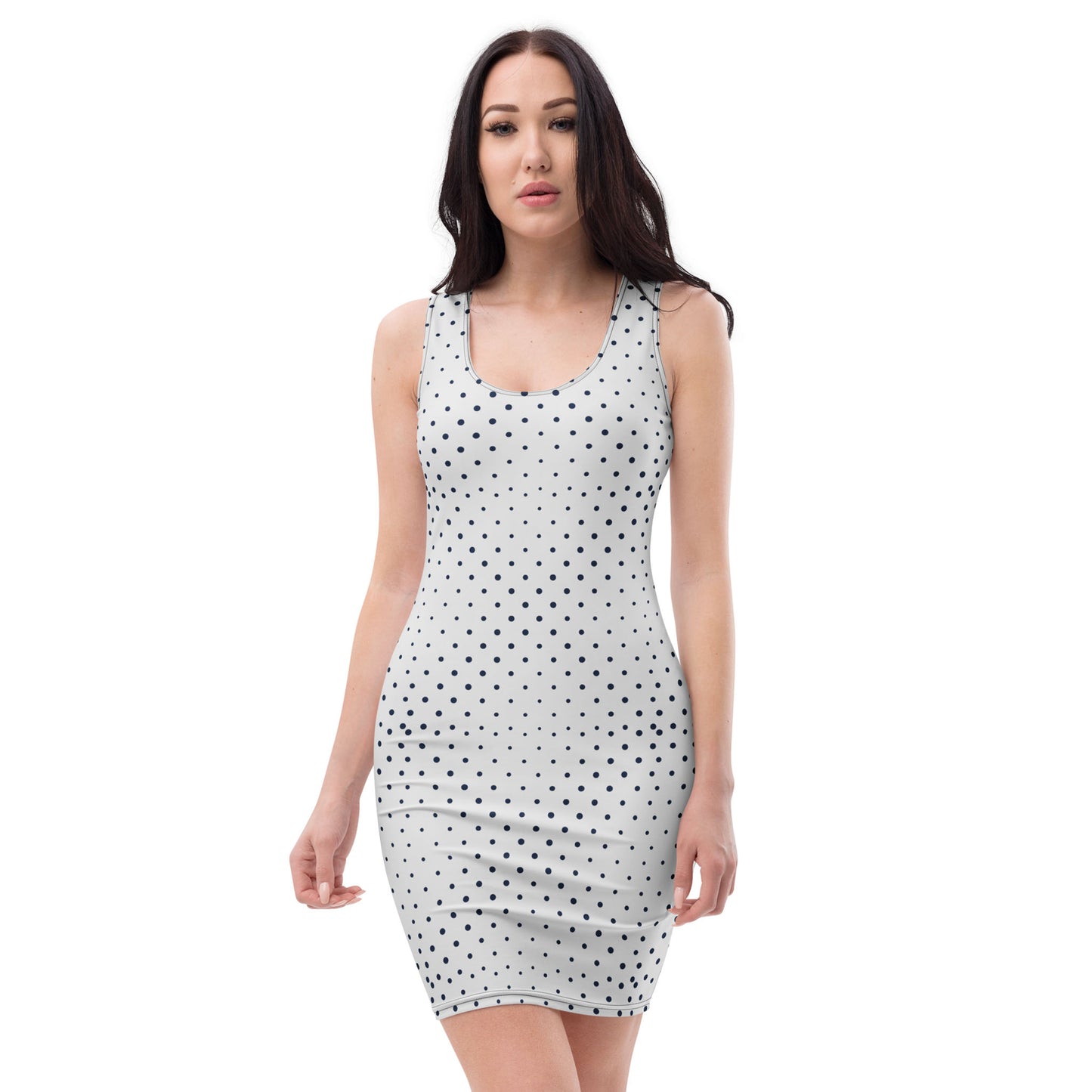 A woman with long dark hair wears a sleeveless, fitted dress with black polka dots, featuring four-way stretch, standing against a plain white background.