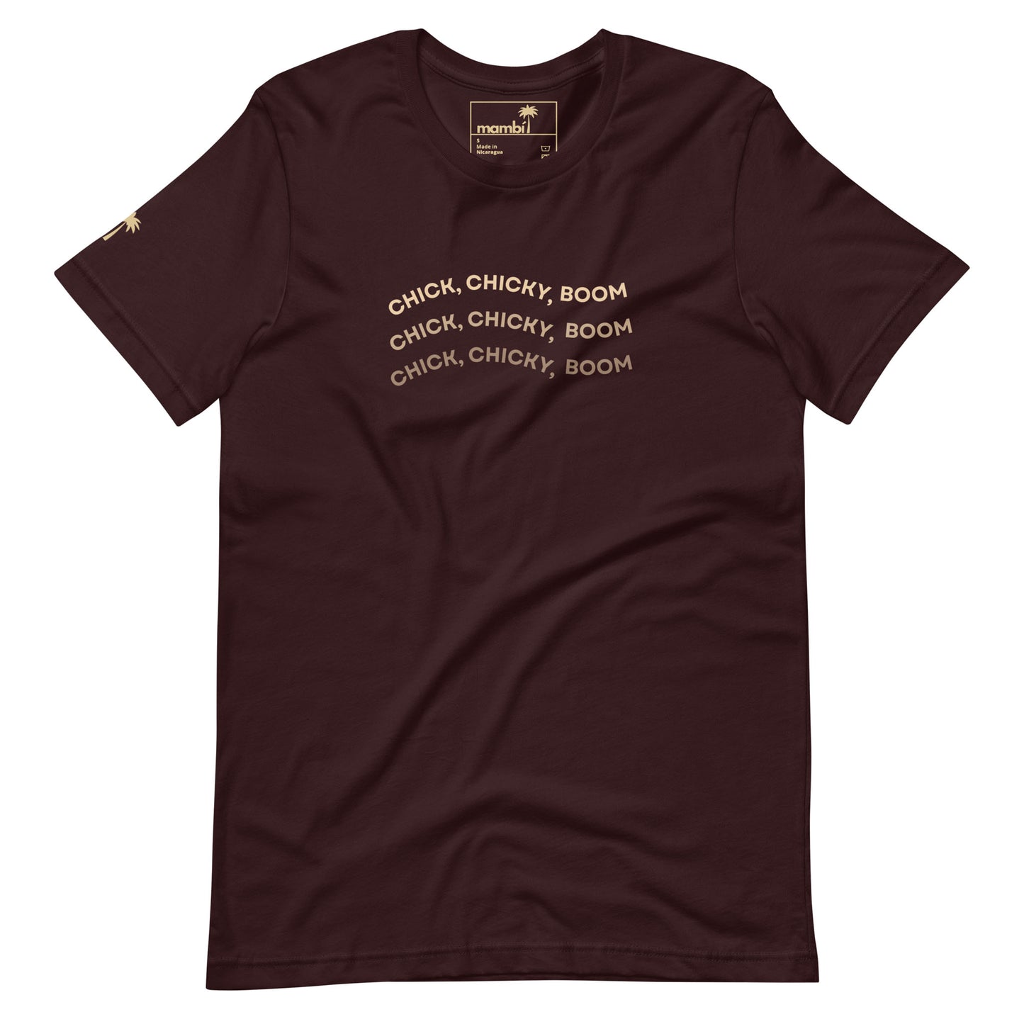 An oxblood black fitted cotton shirt featuring the phrase CHICK, CHICKY, BOOM in beige curved text repeated thrice across the chest and a small gold palm tree on the left sleeve—ideal for fans of playful graphic tees.