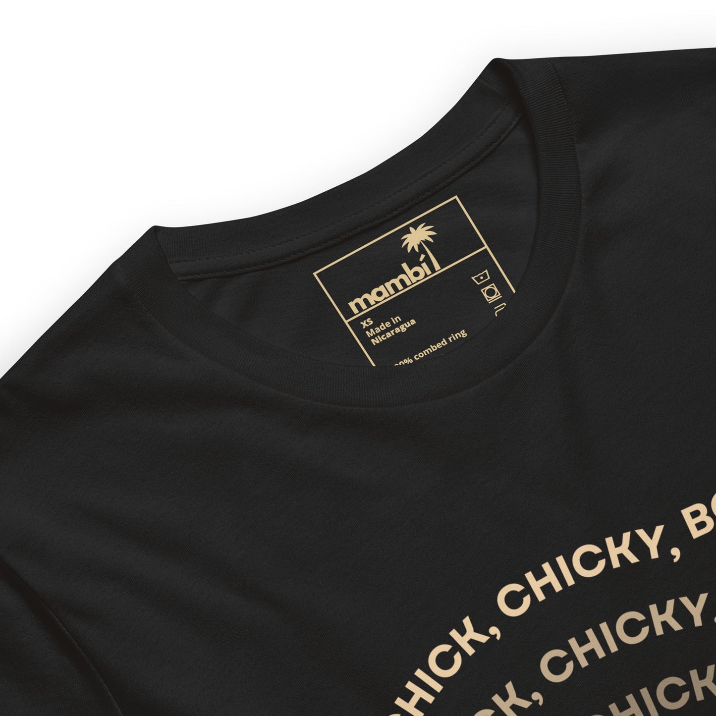 Close-up of a black fitted shirt made from comfortable cotton, featuring a gold printed mambi label inside the collar with sizing and care details. Partial gold text appears on the front, typical of premium graphic tees.