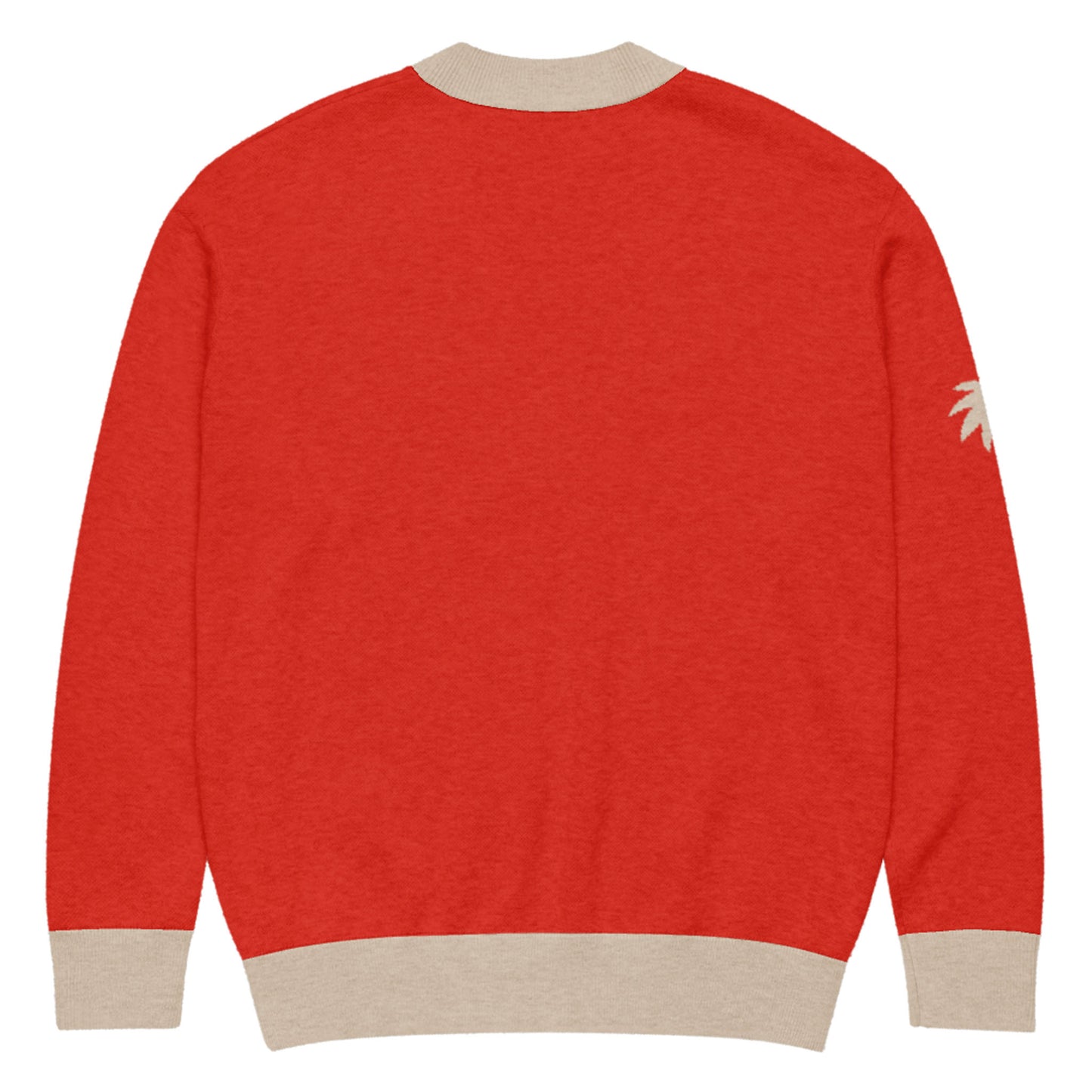 A red two-tone cardigan with beige ribbed cuffs, collar, and hem, shown from the back. A small beige palm tree design accents the upper right sleeve for a subtle touch.