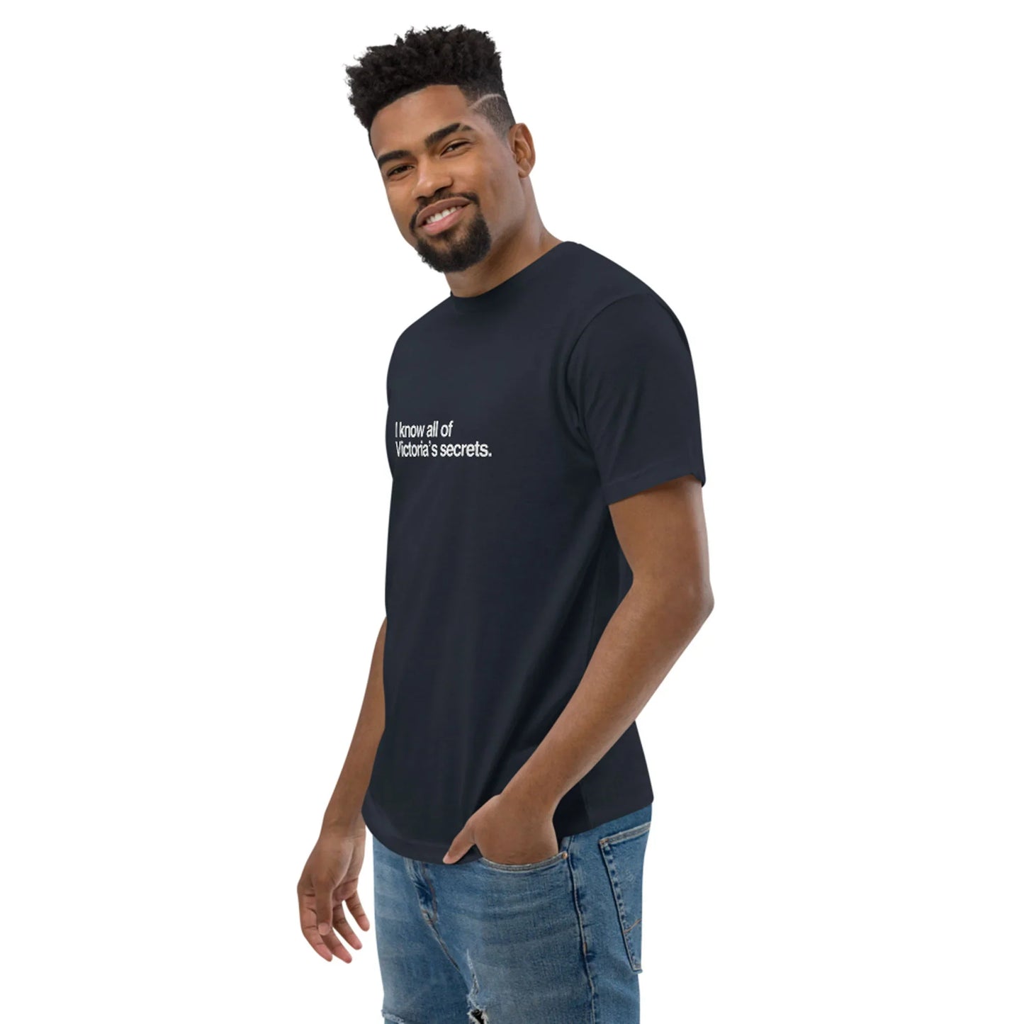 Man wearing a black t-shirt with text on a white background