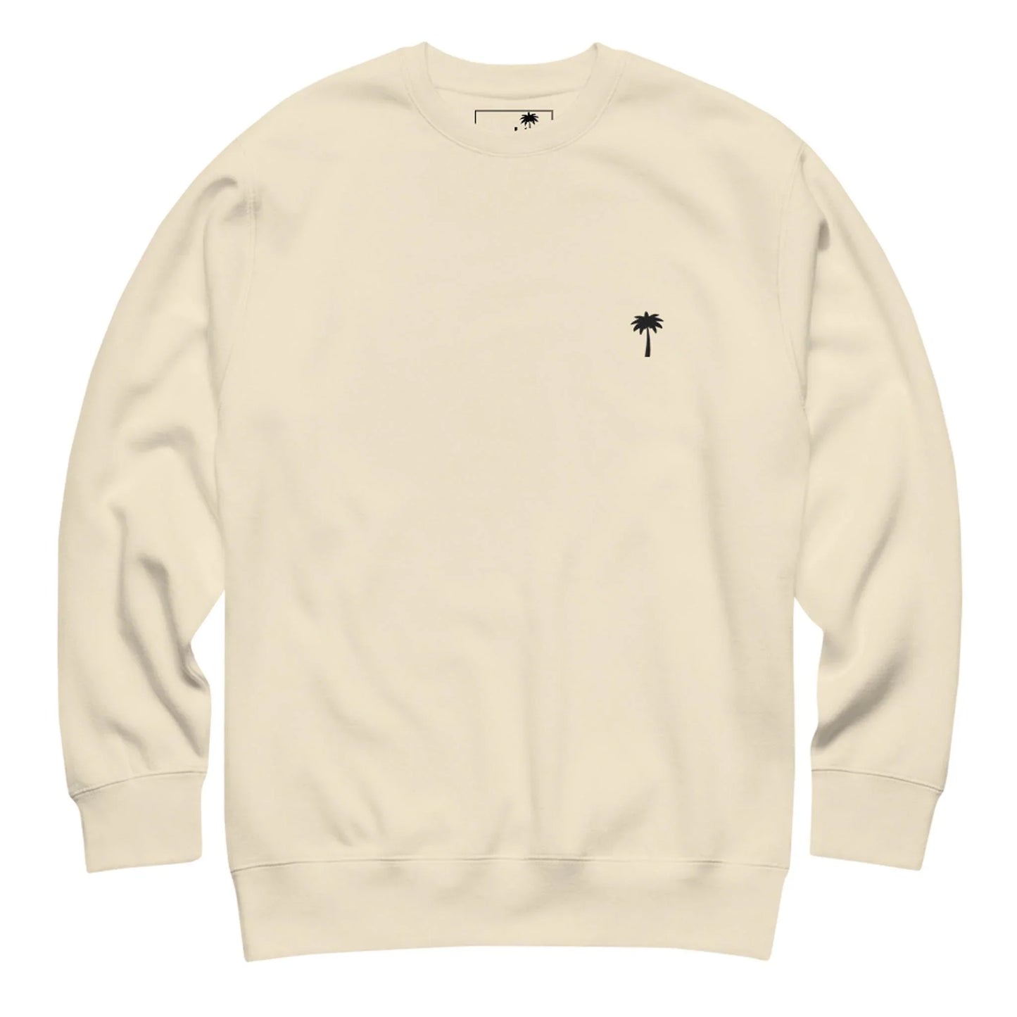 Cream-colored Mambí crewneck sweatshirt with long sleeves and a small black palm tree graphic on the left chest.