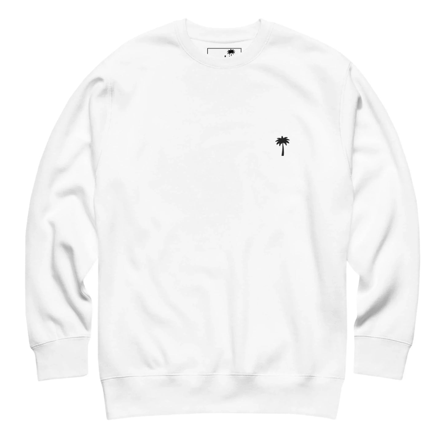 White crewneck sweatshirt with long sleeves and a small black palm tree graphic on the left chest area. The design is simple, minimalistic, and inspired by the Mambí spirit, with no other visible patterns or logos.