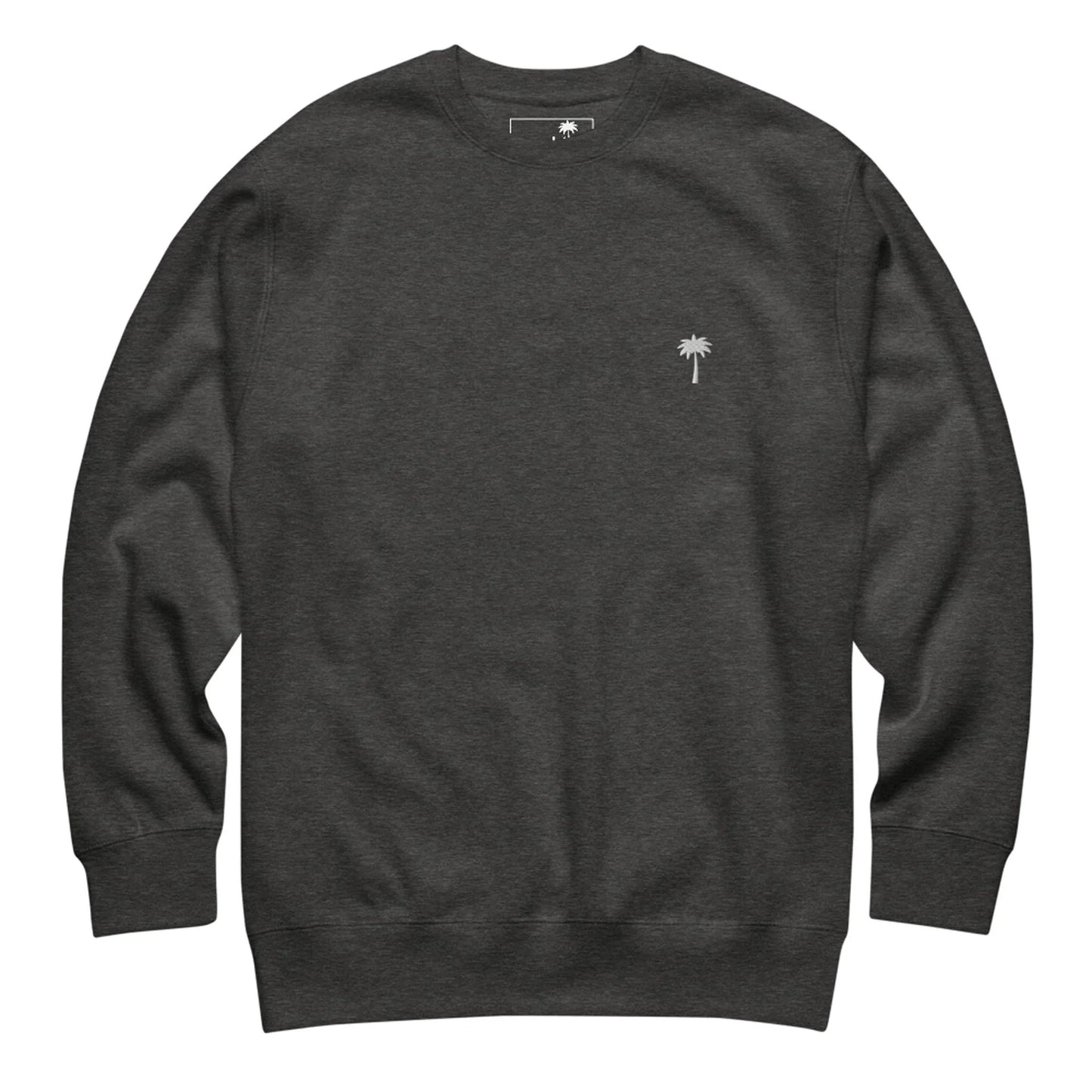 A plain dark gray Mambí crewneck sweatshirt featuring a small white embroidered palm tree on the left chest. The sweatshirt has long sleeves and a relaxed fit.