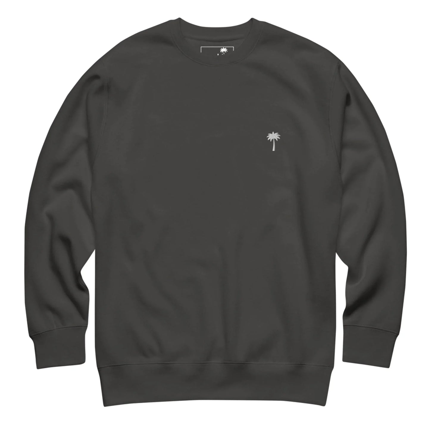 A plain black Mambí crewneck sweatshirt with a small white embroidered palm tree logo on the left chest. The sweatshirt features long sleeves and a relaxed fit.