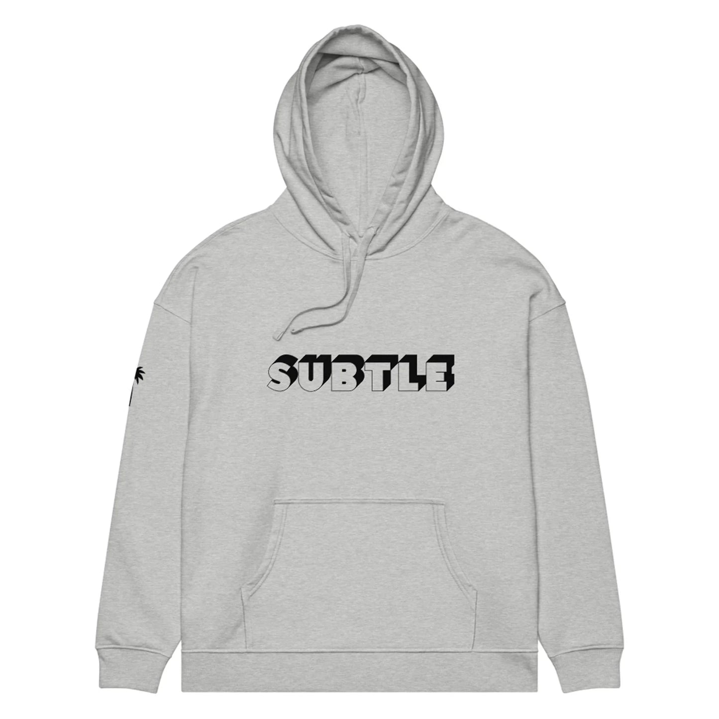 Light gray Mambí hoodie with a front pocket and hood. The word SUBTLE is printed in large black and white block letters on the chest, and a small palm tree graphic accents the left sleeve near the shoulder.
