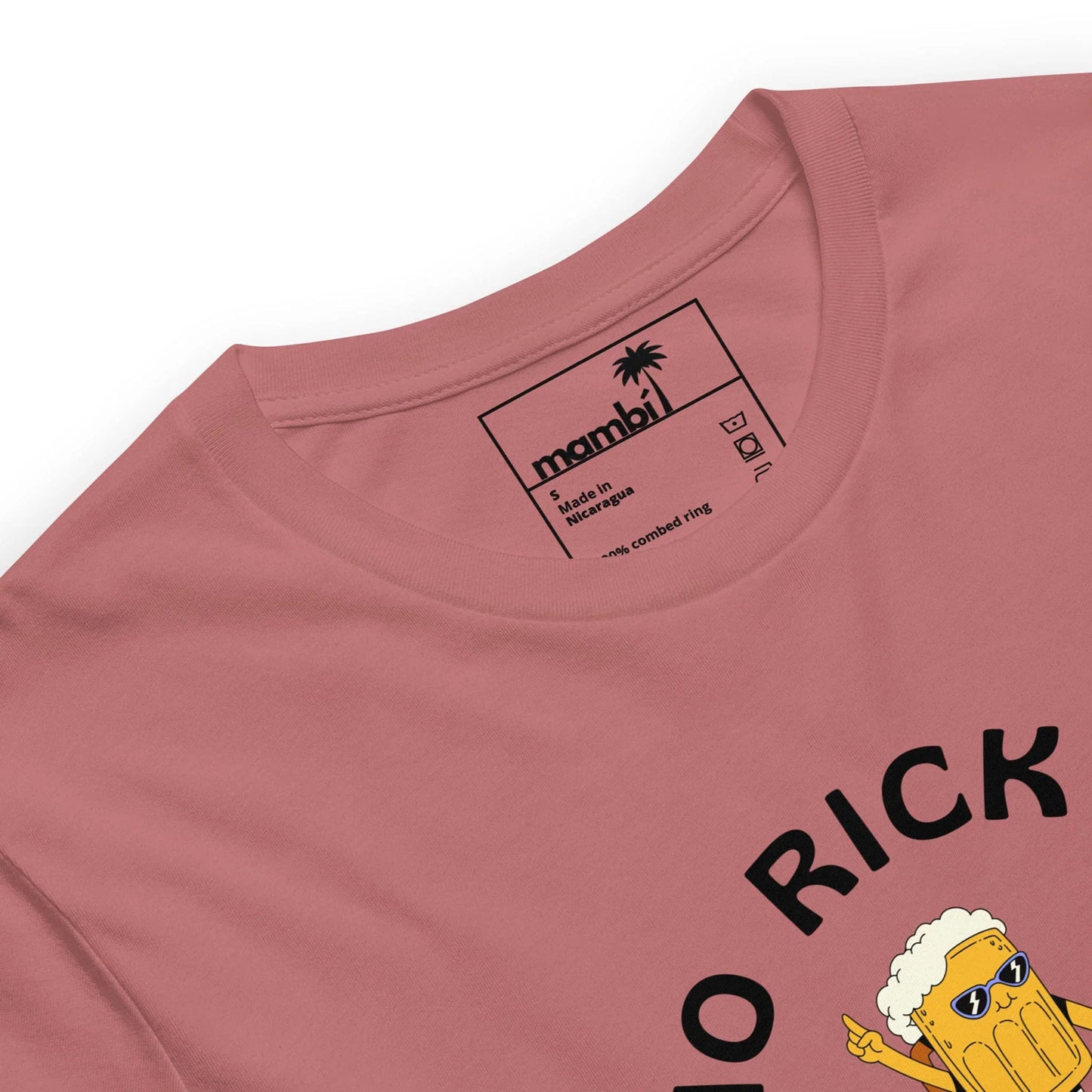 A close-up of a pink t-shirt by Mambí features a cartoon beer mug graphic and bold black text partially reading RICK. The inner collar label displays the Mambí name along with sizing and care details.
