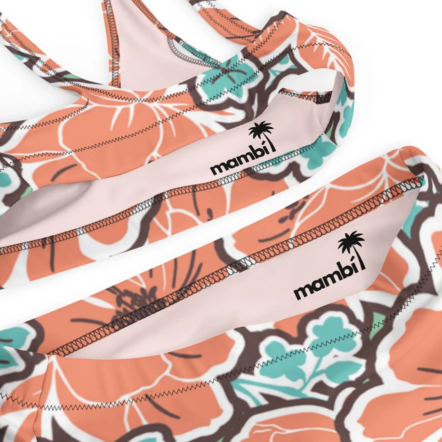 Close-up of the Printful Valeria High-Waisted Bikini Swimsuit for women, featuring orange, turquoise, and white hibiscus patterns. Includes removable pads and a small palm tree logo on the inside band.