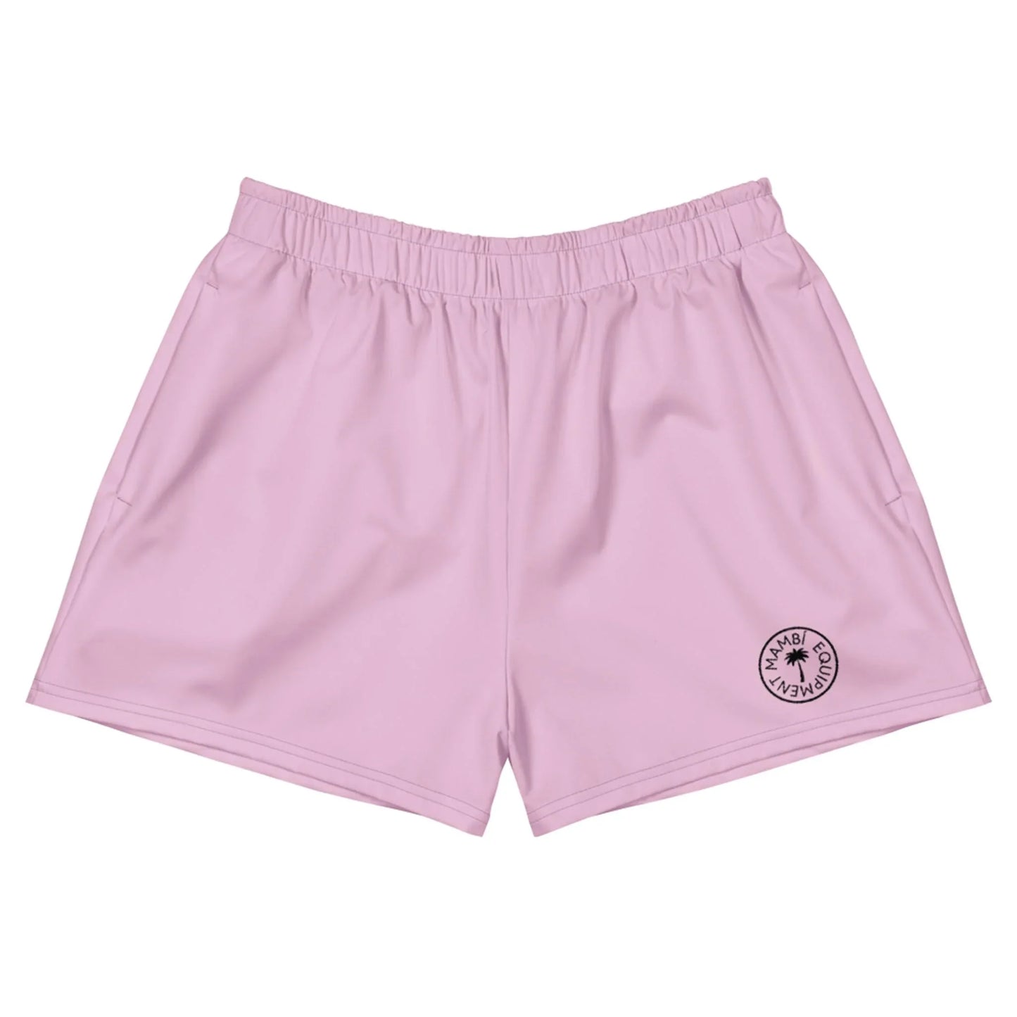 Light pink athletic shorts with an elastic waistband and a small circular black logo on the bottom left leg that reads MIAMI BEACH CLUB around a palm tree icon, featuring Mambí-inspired style. The shorts are laid flat on a white background.