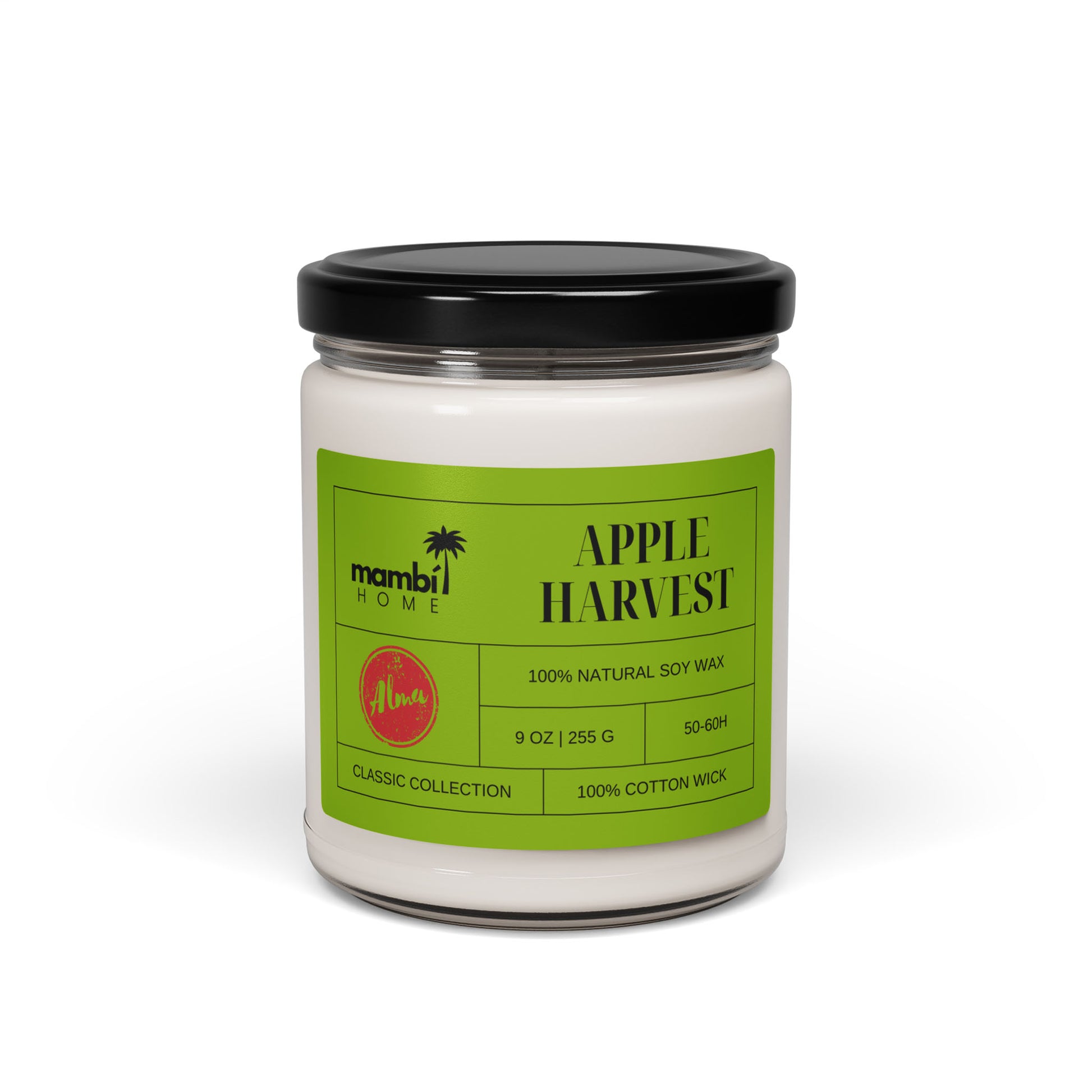 A white candle in a glass jar with a black lid features a green label reading Mambi Home and Apple Harvest. This 9 oz (255g) candle is made of natural soy wax, perfect for those seeking eco-friendly candles.