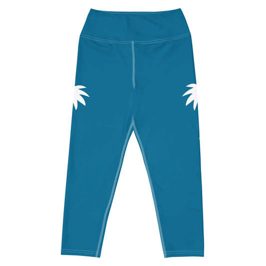 The Aventura High-Rise Yoga Capri Leggings for women by Printful feature white palm leaf designs on blue, high-waisted, four-way stretch fabric—ideal for activewear. Shown flat against a plain white background.
