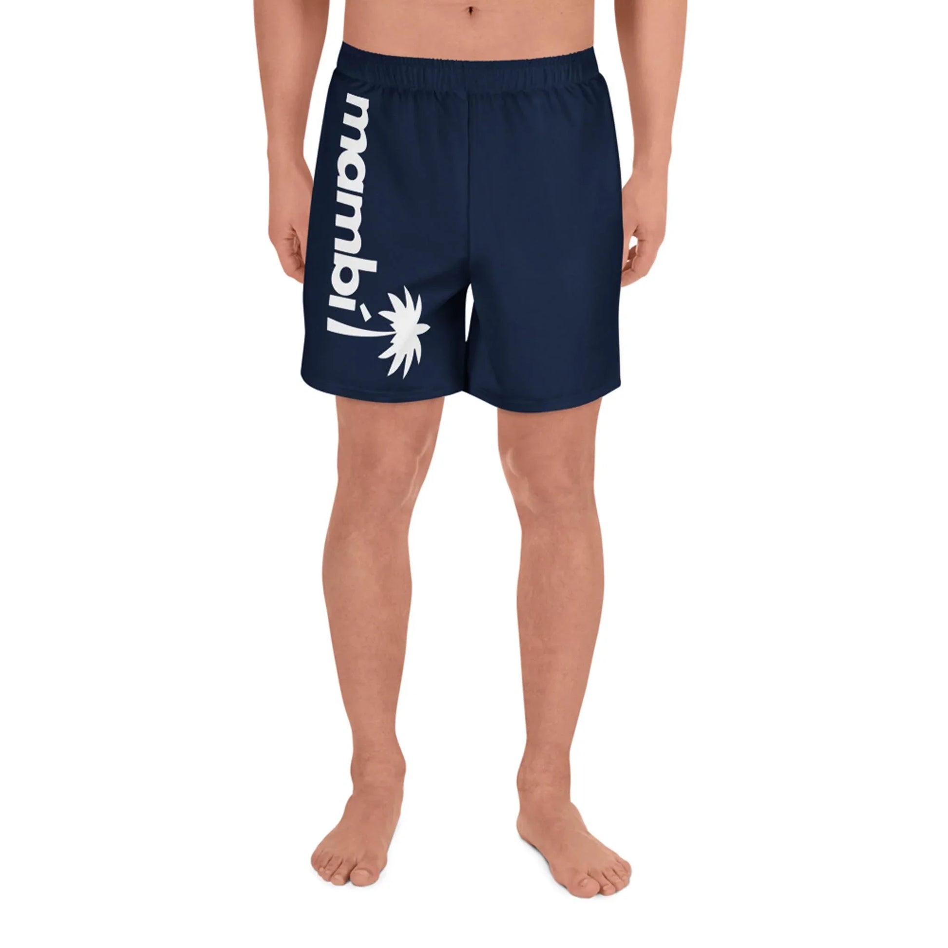 A person stands barefoot wearing navy blue Belmar Long Athletic Shorts by Printful, featuring mambil and a white palm tree graphic on the left leg. Designed for unisex comfort and performance, the background is plain white.