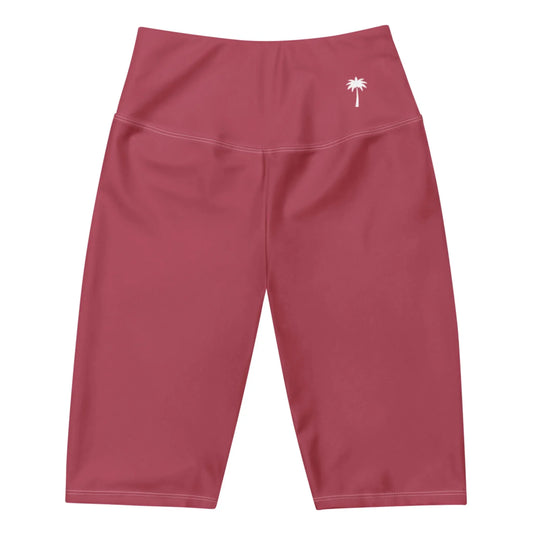 High-waisted, knee-length magenta athletic shorts with a small white palm tree logo and subtle Mambí branding on the left hip, displayed on a white background.