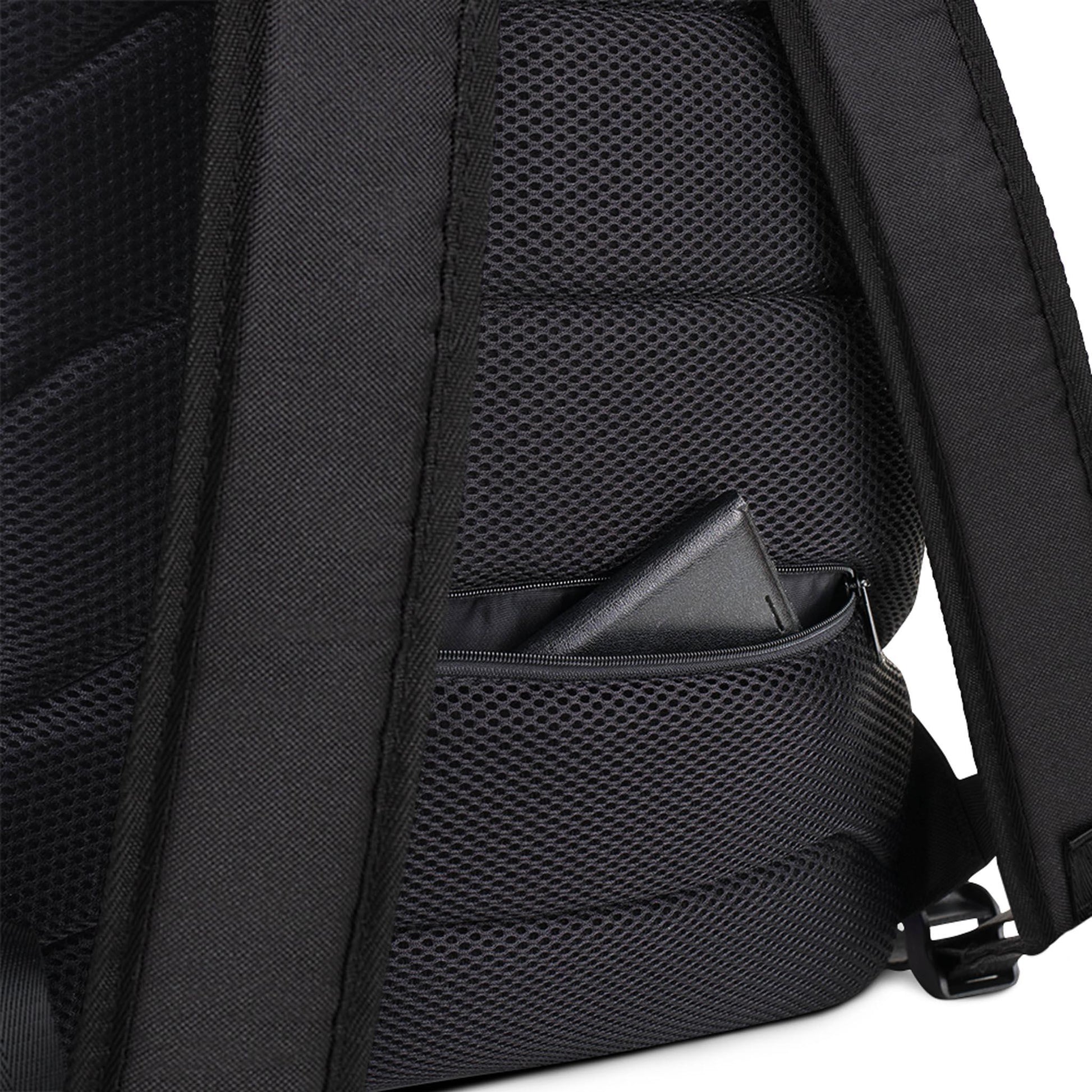 Close-up of the Printful Boulevard East All-Purpose Backpack’s padded back, featuring a small zippered mesh pocket partially open with a black wallet inside. The backpack’s shoulder straps and hidden back pocket are also visible.