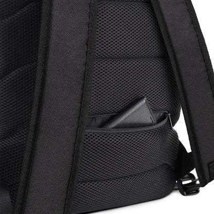 Close-up of the Printful Boulevard East All-Purpose Backpack’s padded back, featuring a small zippered mesh pocket partially open with a black wallet inside. The backpack’s shoulder straps and hidden back pocket are also visible.