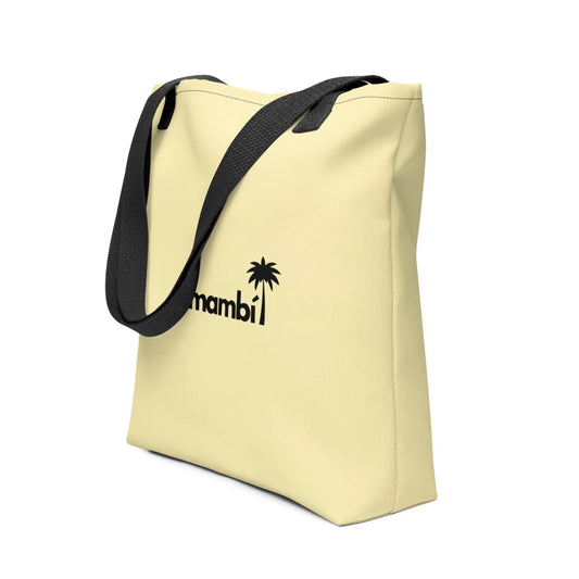 A light yellow tote bag with black shoulder straps and a black palm tree graphic next to the partial word Mambí printed on the front.