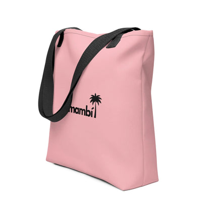 A pink tote bag with black straps features a black palm tree graphic and the word Mambí on the front.