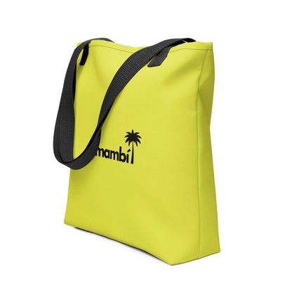 A bright yellow Mambí tote bag with black handles and a bold black palm tree graphic next to the word mambi on the front.