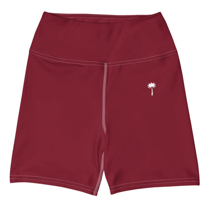 The Brickell Yoga Shorts by Printful feature a high waist, maroon color, white stitching, four-way stretch fabric, and a small white palm tree graphic on the left thigh.