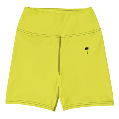 The Brickell Yoga Shorts by Printful feature bright yellow, high-waisted design with black stitching, a high waistband, four-way stretch fabric, and a small black palm tree graphic on the left hip.
