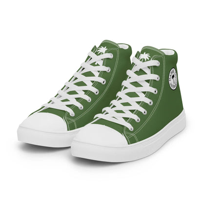 The Carlito Sastre Vintage Hi-Top Sneakers by Printful feature a classic white and fern green design, white laces, rubber soles, and a circular palm tree logo on the side—an iconic mens canvas sneaker with timeless details.