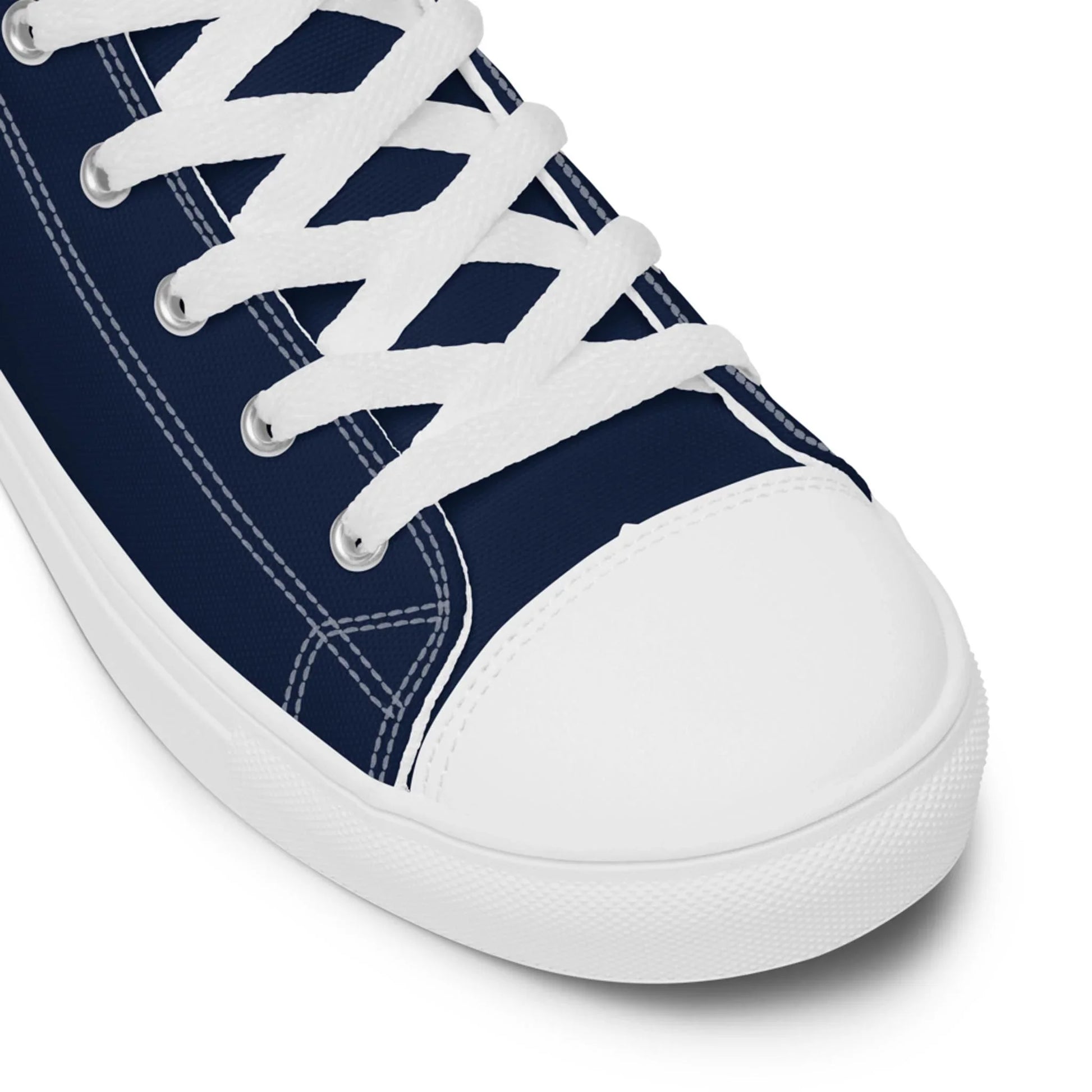 The Carlito Sastre Vintage Hi-Top Sneakers by Printful for men feature a white/navy canvas upper, white laces, stitching, and a classic rubber toe cap and sole—showcasing timeless style against a clean white background.
