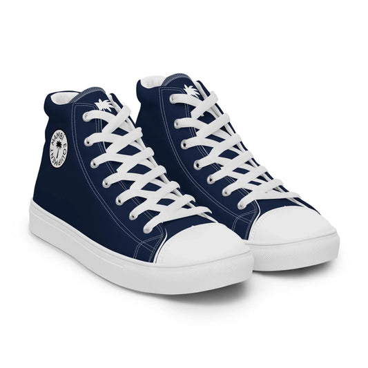 The Carlito Sastre Vintage Hi-Top Sneakers by Printful feature a navy and white design, white laces and soles, plus a circular palm tree “Summer Island” patch on the side. Mens sizing.