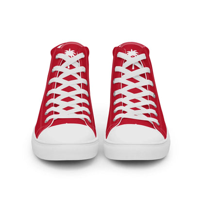 A pair of red high-top sneakers with white laces, white toe caps, and a white palm tree design on the tongue featuring subtle Mambí details, shown from the front against a plain white background.
