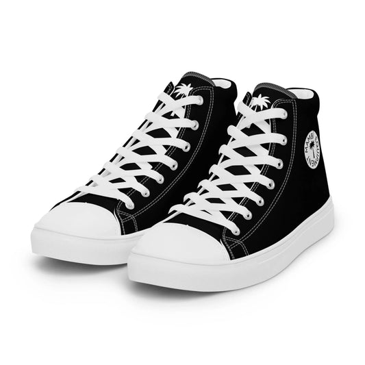 The Carlito Sastre Vintage Hi-Top Sneakers by Printful for women feature a black canvas upper, white laces, toe caps, and soles, plus a round palm tree logo with text on the side.