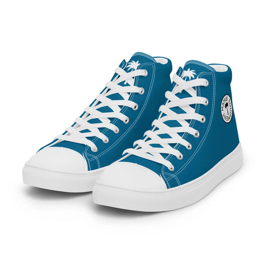 A pair of blue Mambí high-top sneakers with white laces, white soles, and a round black-and-white logo featuring palm trees and text on the side. The shoes are displayed on a white background.